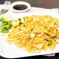 Pineapple Fried Rice · Pineapple fried rice with bell peppers, carrots, onions, and cashews.