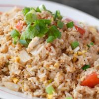 Crab Fried Rice · Fried rice with real crab, egg, white onions, green onion, carrots, and tomatoes garnished w...