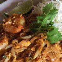 Pad Thai · Stir-fried rice noodles, eggs, bean sprouts, green onions, and carrots topped with ground pe...