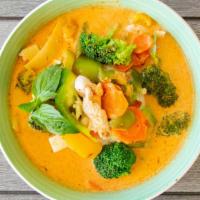 Ruby Red Curry · Coconut milk with bamboo shoots, white onion, bell pepper,  carrots, and basil leaves in red...