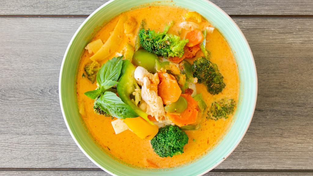 Ruby Red Curry · Coconut milk with bamboo shoots, white onion, bell pepper,  carrots, and basil leaves in red curry sauce.