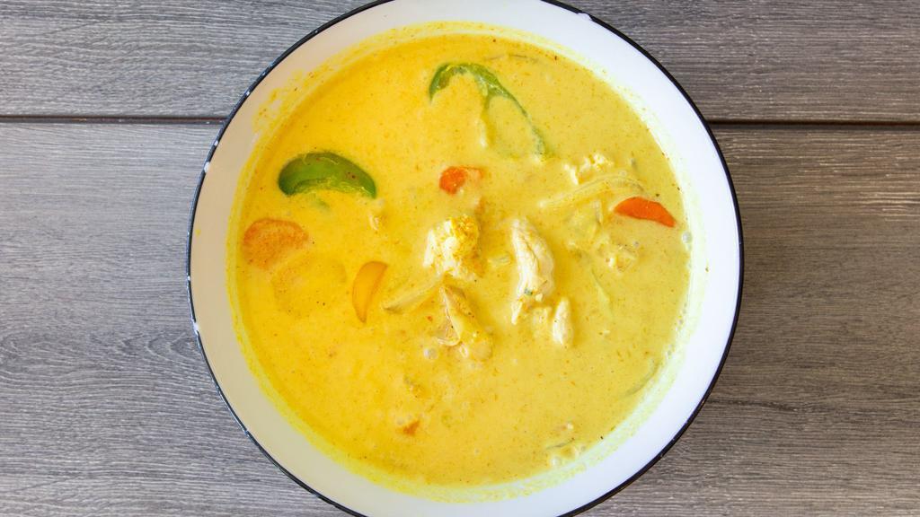 Yellow Curry · A mild-flavored yellow curry cooked in coconut milk, potato, white onion, bell pepper, and carrots.