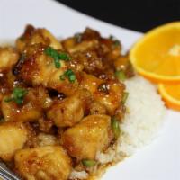 Orange Chicken · Tempura chicken pieces coated with a sweet and sour orange flavored chili sauce, served on b...