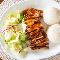 Spicy Chicken Teriyaki · Teriyaki chicken sauteed in a spicy sauce served with rice and salad.