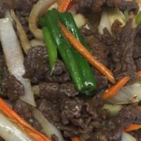 Beef Bulgogi · Thin slices of beef sautéed with carrots & white and green onions in a savory sauce and serv...