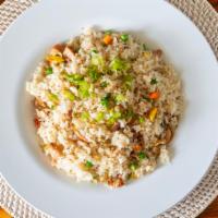 Chicken Fried Rice · Rice sautéed with chicken, egg, peas, and carrots.