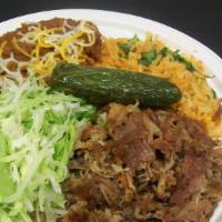 Combo # 13.- Carnitas Plate (Shredded Pork) · Comes with a side of lettuce, Mexican salsa and guacamole.