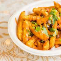 Masala Fries · Loaded Indian fries tossed in sweet and spicy spices doused with house tikka sauce, onions, ...