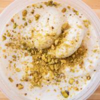 Ras Malai · Fresh cheese patties served cold in sweetened milk garnished with pistachios