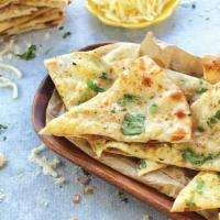 Shack Naan · Naan bread + garlic, cilantro, and cheese