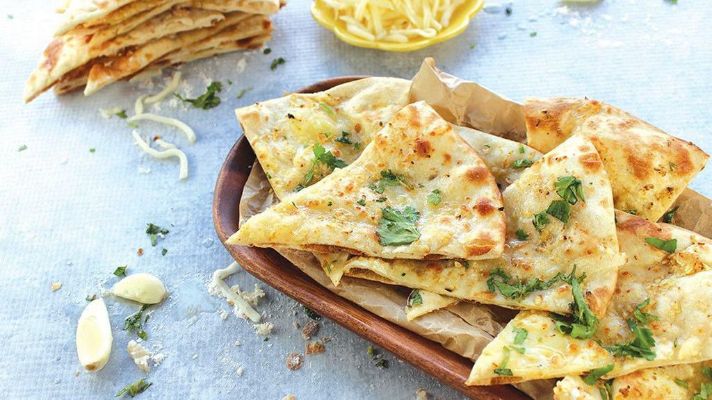 Shack Naan · Naan bread + garlic, cilantro, and cheese
