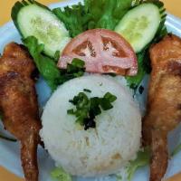 Com Canh Ga Don Thit · Steamed rice with deep-fried chicken wings stuffed with ground pork.