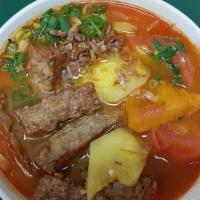Bun Cha Ca · Fish patties vermicelli noodle pork soup cabbage, tomato, and pumpkin.