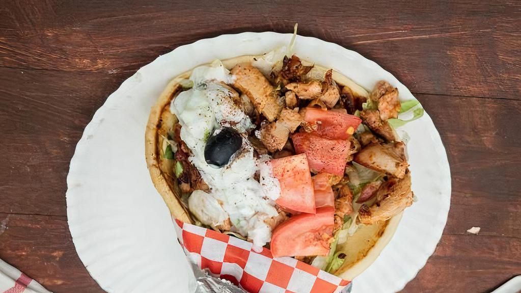 1-Large Chicken Shawarma  Gyro  · Chicken, onion, tomato, lettuce, pickles, tzatziki and choice of sauce.