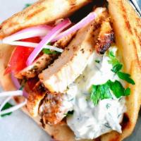 Chicken Gyros Pita Sandwich · Prepared with fresh chicken gyros served on a Greek pita bread with lettuce, tomato, onions ...