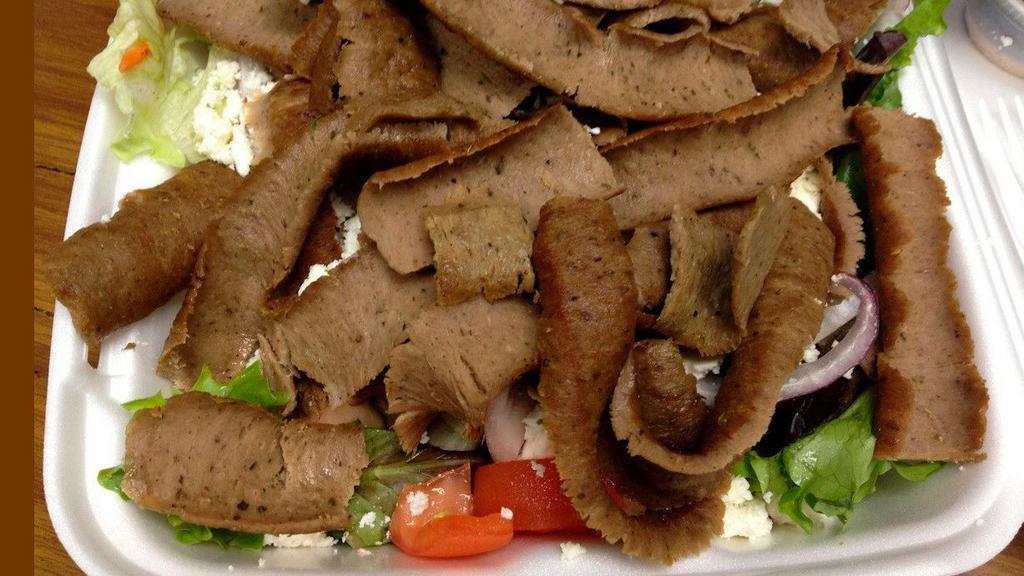 Gyros Salad With Pita · Famous gyros on romaine lettuce, tomato, bell peppers, cucumbers, pepperoncini, olives, feta cheese and pita bread. Served with a side of homemade tzatziki sauce and your choice of salad dressing on the side.