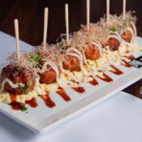 Takoyaki (Octopus Balls) · Battered octopus over egg tartar topped with kewpie mayonnaise, okonomiyaki sauce, fresh cut...