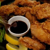 Crispy Chicken 10 Pc · Juicy fried chicken thigh with an original garlic pepper served with mixed baby greens and J...