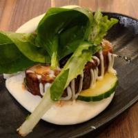 Jinya Bun (1 Piece) · Steamed bun stuffed with slow-braised pork chashu, cucumber and baby mixed greens served wit...