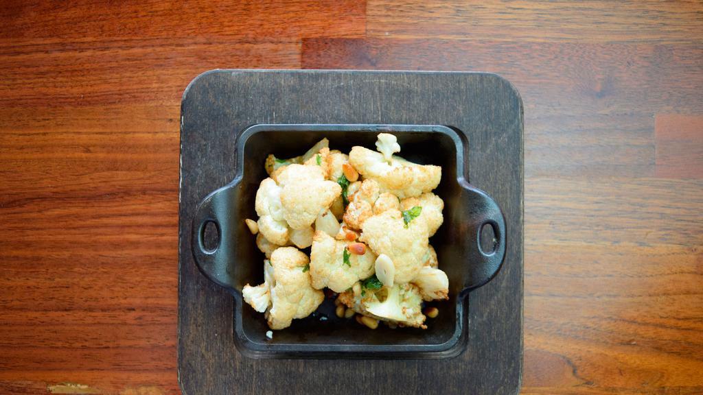 Caramelized Cauliflower · Vegetarian, gluten-free. Caramelized cauliflower with toasted pine nuts, crispy mint leaves and lime sauce. 260 cal.