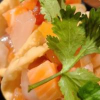 Salmon Poke* · Jinya's original salmon poke in a crispy wonton taco topped with cilantro

*raw item