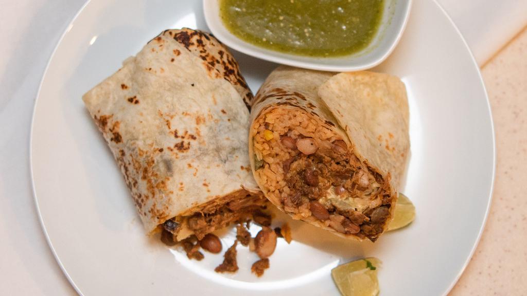 Burrito · Large flour tortilla filled with beans, rice, lettuce, sour cream, cheese, and guacamole.