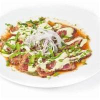 Ten Spice Tuna Tataki · Seared tuna, jalapeño, garlic ponzu, and cilantro allioli.