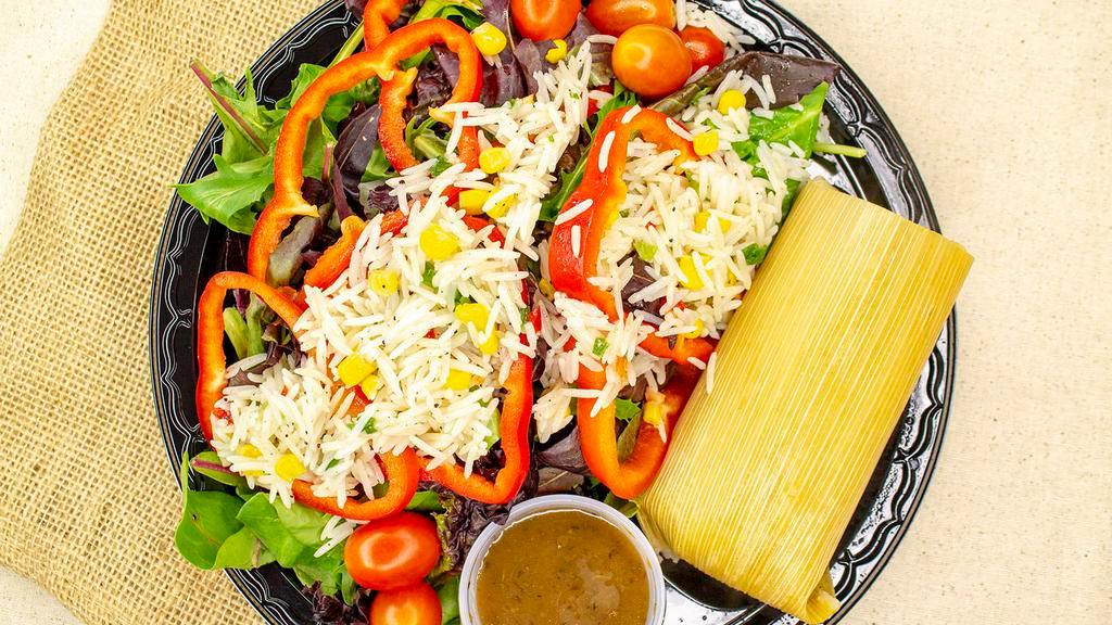 Tamale Salad · Large organic green salad, red peppers, roasted corn, tomatoes, sprinkled with cold basmati rice salad and topped with your choice of tamale.