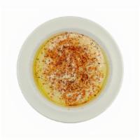 Hummus · Pureed garbanzo beans mixed with tahini, fresh lemon juice, garlic, olive oil, served with o...