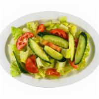 House Salad · Fresh lettuce mixed with tomatoes and cucumbers dressed with our lemon citrus dressing.