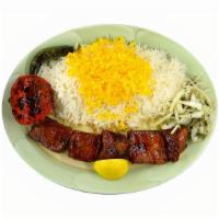Shish Kabob · Chunks of marinated beef charbroiled over open fire, served with basmati rice topped with sa...
