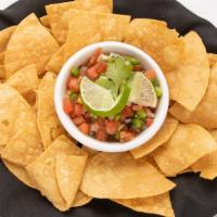 Tortilla Chips · House-Made tortilla chips. 
Served with your choice of dip.