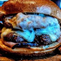 Smokehouse Double · Two Beef Patties / BBQ Pulled Pork / Black Forest Ham / Swiss / Provolone / BBQ Sauce 

Serv...