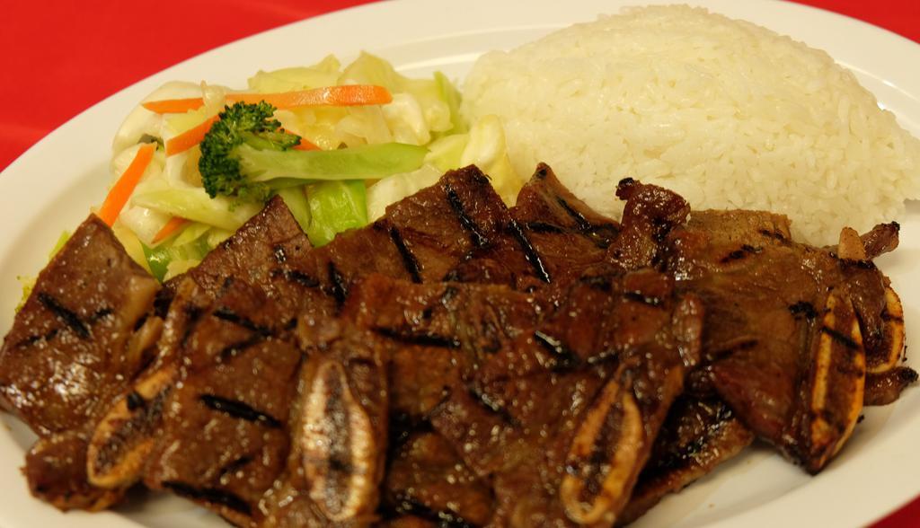 Beef Short Ribs · Meats are charbroiled and served with steamed rice and steamed veggies.