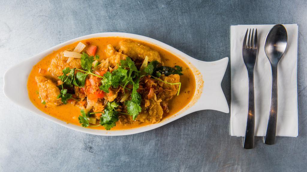 Red Curry Fish · Spicy. Slice cod fish cooked in red curry sauce, basil leaves, peas and carrots, and onion.