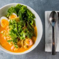 Laksa · Spicy. Popular Malaysian spicy rice noodle soup with chicken, prawn, topped with boiled egg,...