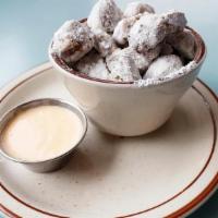 Steubie Snacks** · Deep fried pork shoulder covered in powdered sugar, served with a side of chili garlic aioli
