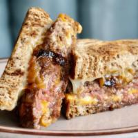 Patty Melt** · Rye bread, beef patty cooked to medium, caramelized onions, Swiss and American cheese, Russi...