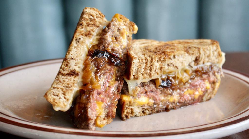 Patty Melt** · Rye bread, beef patty cooked to medium, caramelized onions, Swiss and American cheese, Russian dressing.