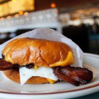Bodega Breakfast Sandwich** · Everything seasoned Brioche bun, scrambled egg, American Cheese. Choice of bacon, sausage, c...