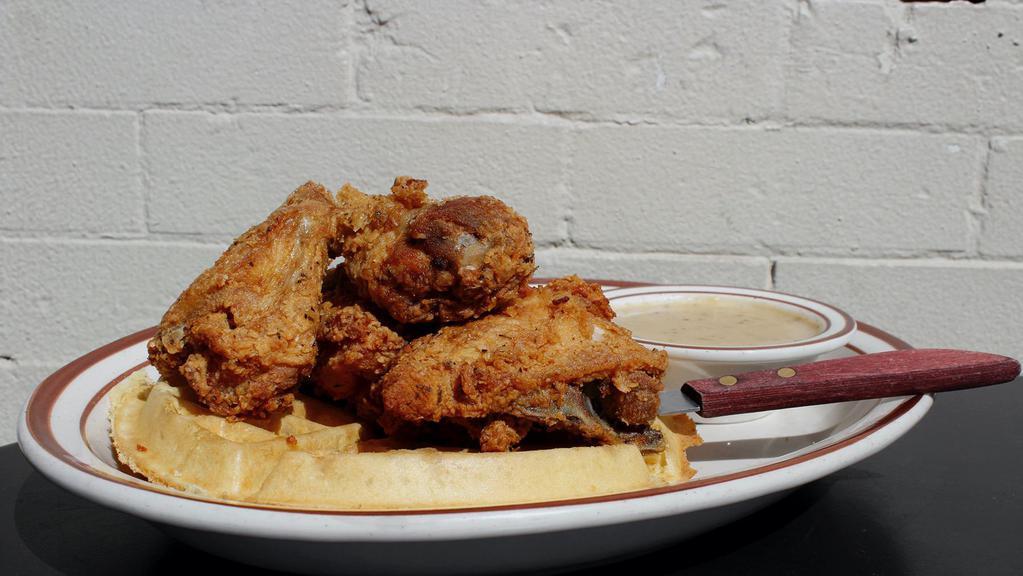 Chicken & Waffle** · Buttermilk brined bone in fried chicken, Belgian Waffle served with Chicken Gravy and Maple Syrup