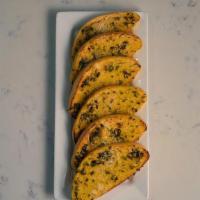 Garlic Bread · Garlic, parsley, parmesan, and extra virgin olive oil.