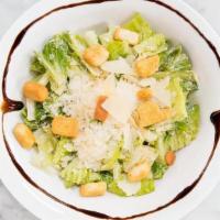 Caesar Side Salad · Romaine lettuce, Parmigiano-Reggiano, croutons and Caesar dressing.