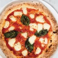 Margherita Pizza · Italian tomato sauce, fresh mozzarella, Parmesan, basil and extra virgin olive oil.