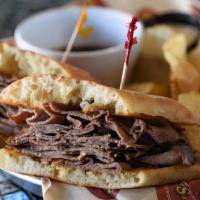 French Dip · Thinly sliced roast beef piled high on a ciabatta roll with a side of horseradish sauce and ...