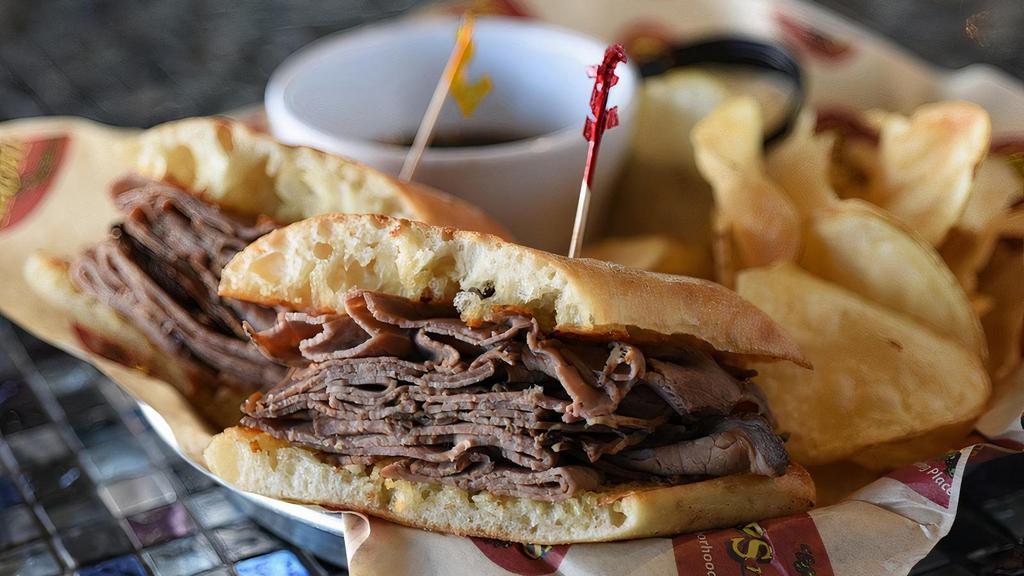 French Dip · Thinly sliced roast beef piled high on a ciabatta roll with a side of horseradish sauce and au jus.