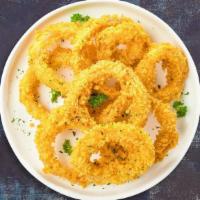 Crispy Onion Rings · Sliced onions dipped in a light batter and fried until crispy and golden brown.