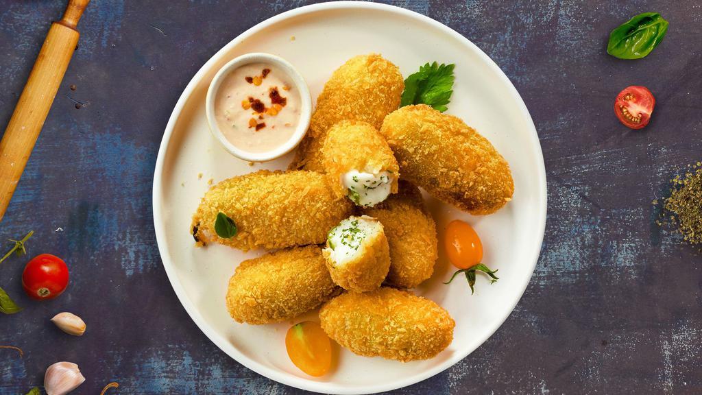 Cheesy Peno Poppers  · Fresh jalapenos filled with cream cheese, breaded, and fried until golden brown