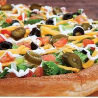 Nacho Pizza · Vegetarian. Taco sauce, refried beans, black olives, tomatoes, jalapeños, lettuce, sour crea...