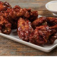 Bone In Wings · One pound of Bone-In Chicken Wings.  Crispy on the outside, plump and juicy on the inside. O...
